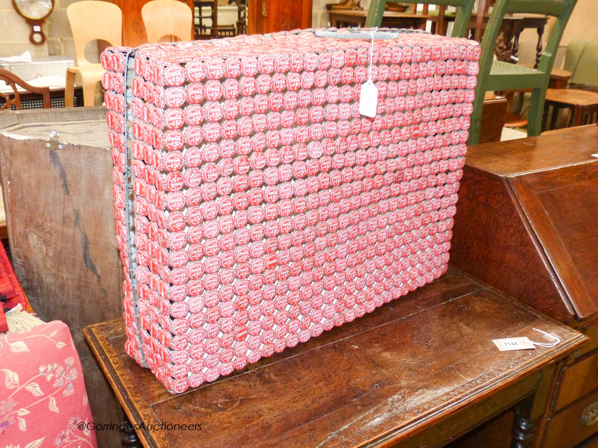 An unusual wirework suitcase, made from vintage Coca Cola bottle caps, 51 x 71cm.